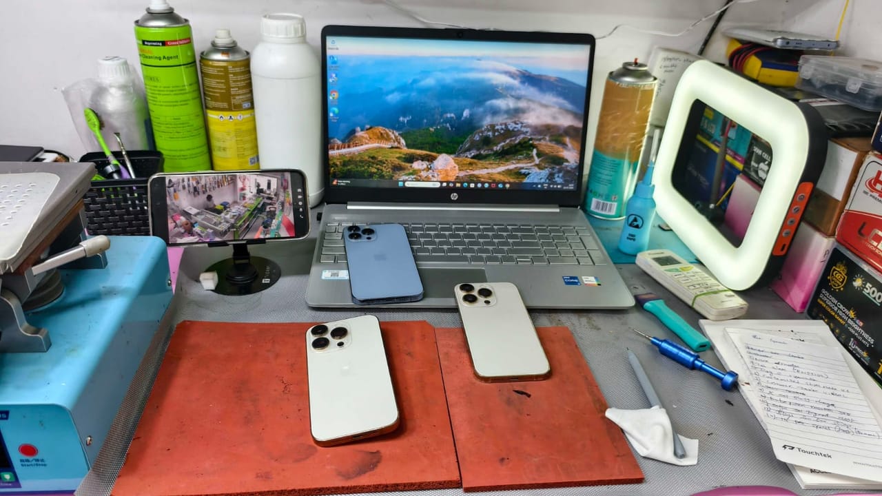 iPhone repairs in progress on the service bench
